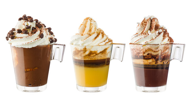 Collection of cups of coffee with whipped cream, isolated on white.