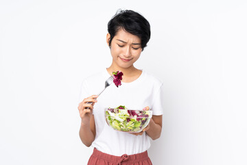 Young Vietnamese woman with short hair holding a salad over isolated background