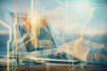 Multi exposure of world map hologram with man working on computer on background. Concept of worldwideweb.