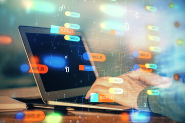 A man working on Laptop with technology theme drawing. Concept of big data. Double exposure.