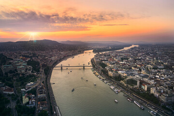 Aerial view of the city of Budapest during summer sunset. Bridges of Budapest, Danube river and Budapest Eye in panorama. Popular travel destination in Hungary, Europe.
