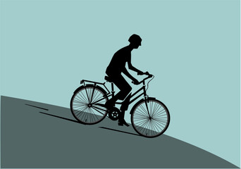 Silhouette of a man riding a bike
