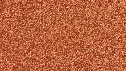Bright orange painted plaster texture