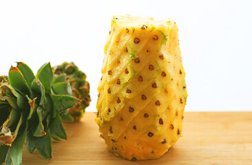 Raw pineapple with green background-image