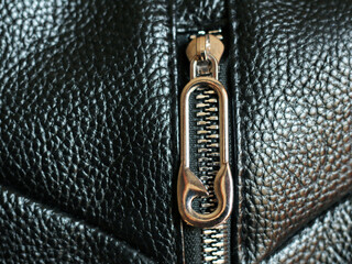 Metal zipper on leather bag