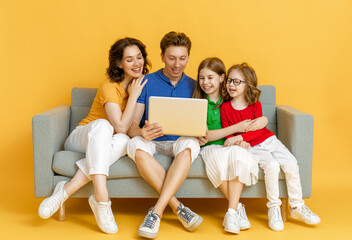 Happy loving family on bright color background.