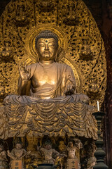 Fototapeta na wymiar Gold statue in Japan, religion