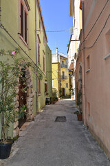 A narrow street between the old buildings of Venafro, a medieval village in the Molise region.