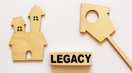LEGACY word about building blocks and homemade houses concept on white background