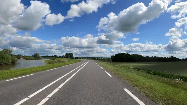 POV Driving on dike road in farmland between Deventer and Zwolle in the Netherlands