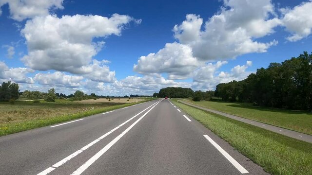 POV Driving on dike road in farmland between Deventer and Zwolle in the Netherlands