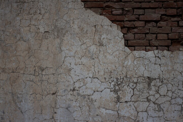 Old collapsed wall with plaster