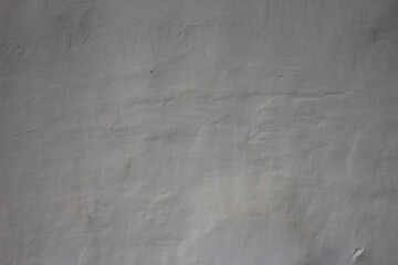 Old wall covered with white plaster