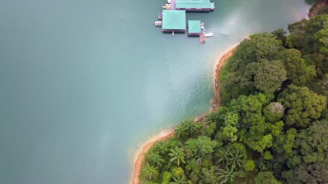 Aerial view of forest island and resort water chalet in Kenyir Lake, Terenganu Malaysia.
