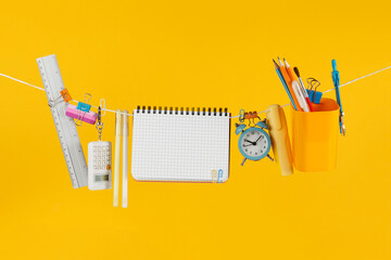 Sale of school supplies, on yellow background. Banner or flyer, overhead.
