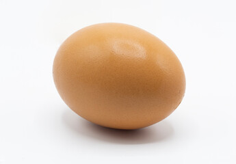 One brown chicken's egg isolated on white background.