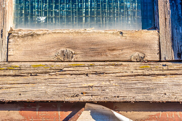 A close view of weathered and aged wooden boards used in a house construction