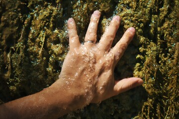 My own hand, under a waterfall. Clear fresh water 