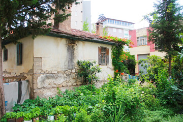 Fototapeta na wymiar Antalya Turkey June 25, 2010. An abandoned old a house on the street.