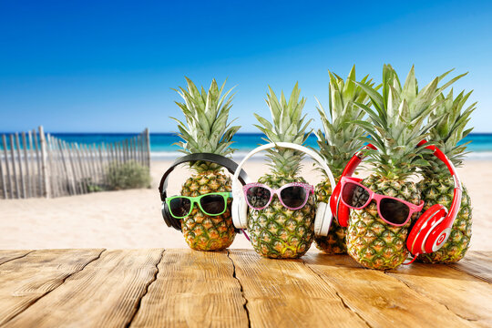 Fresh fruits on desk and summer beach landscape 