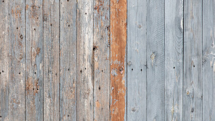 Wooden boards on an old fence as an abstract background.