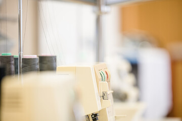 Seamstress crocheting wool close-up. Handmade and hobbies. A knitter is sewing a yellow knitted toy.