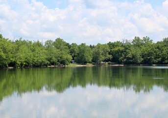 A beautiful sunny day at the fishing lake at the park.