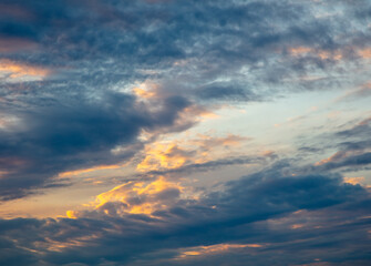 Naklejka na ściany i meble Clouds after rain on the sky at sunset.