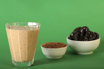 yogurt smoothies made from kefir and prunes in a glass glass