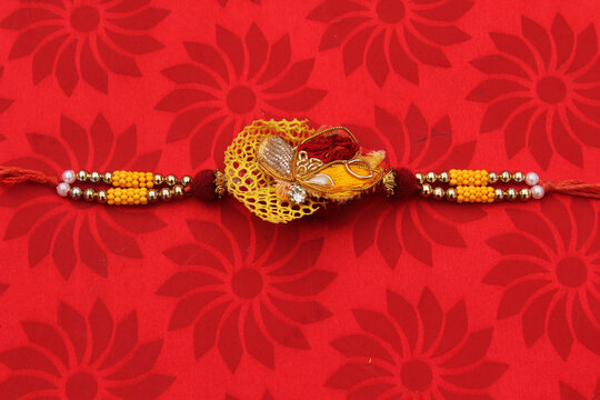 Rakhi : A traditional Indian wrist band which is a symbol of love between Brothers and Sisters.