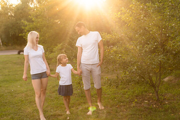Fototapeta premium happy young family spending time outdoor on a summer day