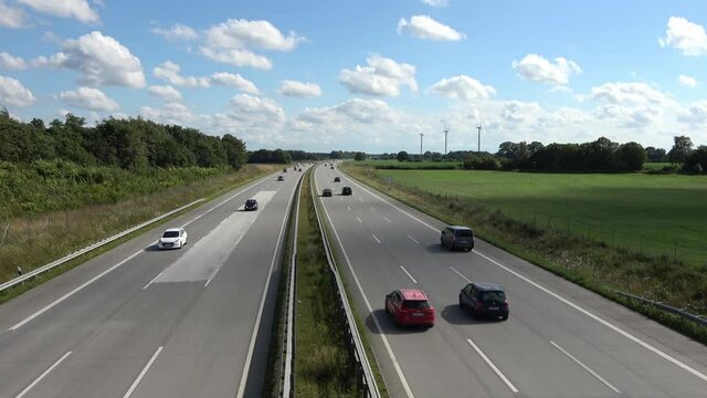 Perspective view from a bridge at the traffic on the german highway called A7 between Flensburg and Hamburg