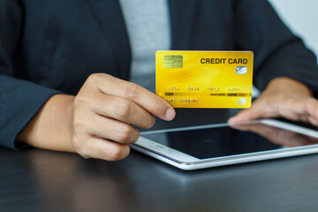 Online payment,Man's hands holding a credit card and using smart phone for online shopping