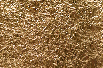 Crumpled wrinkled golden foil texture