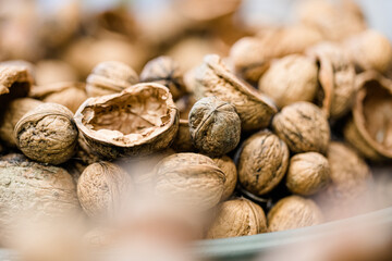 Florist at work: woman making rose hip and hawthorn wreath