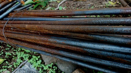 A pile of iron for partially rusty building construction
