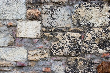 Stone wall, stonewall pattern background, old aged weathered texture