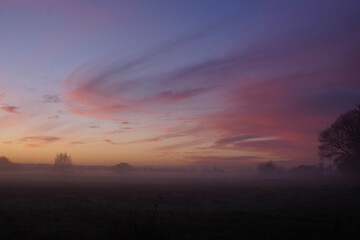 Misty Sunset orange light on swirling clouds Somerset atmospheric 
