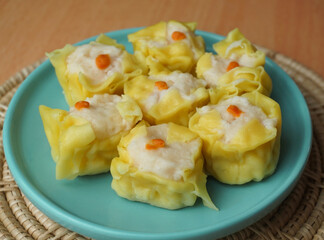 Close up Traditional Chinese dumpling on green dish.