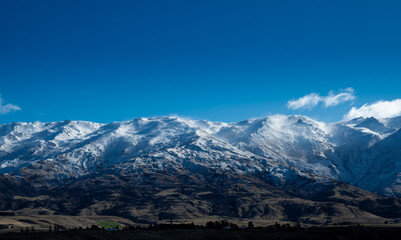 Obraz na płótnie Canvas Winter landscape of snow mountain against blue sky in South island, New Zealand.