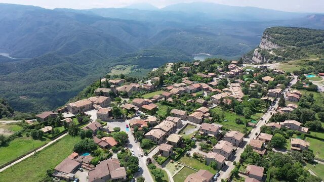 Scenic aerial view of small town of Tavertet located on edge of cliffs on summer day, Catalonia, Spain