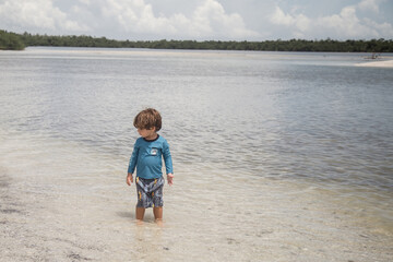 little boy is shelling on Marco Island 10000 islands 