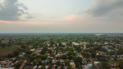 Fototapeta premium Aerial view of Indian agricultural fields and village