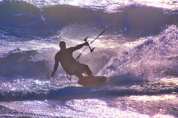 Kite surfer in the waves on Blouberg Beach, Western Cape, South Africa