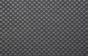 The texture of dense gray fabric in a checkerboard pattern.Dense fluted grey fabric texture.Grey patterned fabric background.