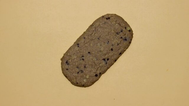 Cookies with cereals on a yellow background.