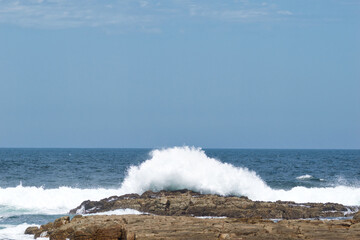 Fototapeta na wymiar Waves breaking near Gouritzmond, Garden Route, Western Cape