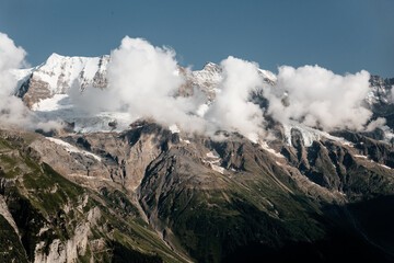 Scenic view on green mountings and sky in Lauterbrunnen Valley, Switzerland