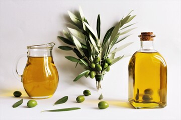 Olive oil bottle, olive oil jar,bundle olives branches,green olives. photo 