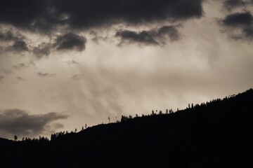 dark clouds and rain over the mountains